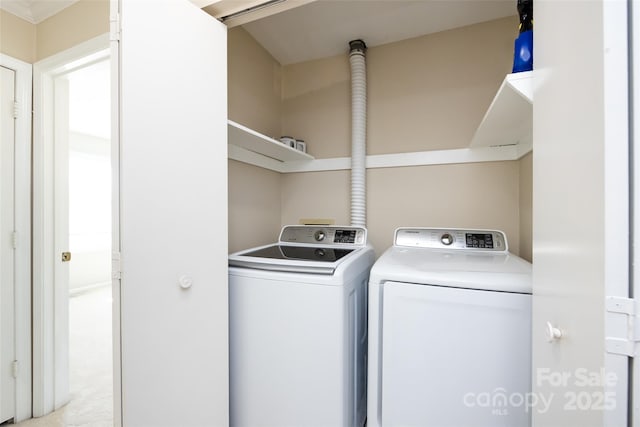 clothes washing area with laundry area and independent washer and dryer