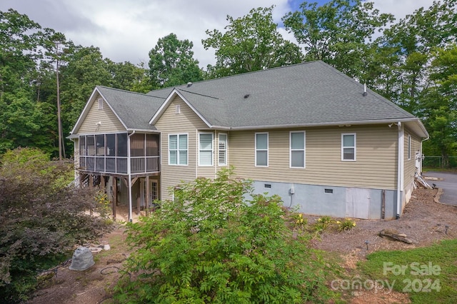 exterior space featuring a sunroom