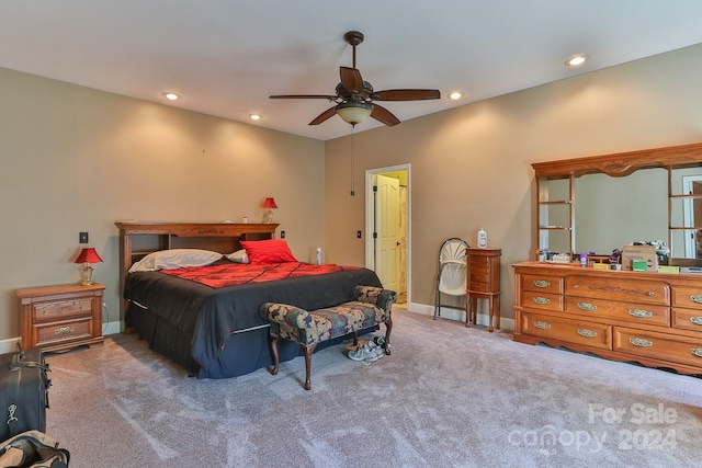 bedroom featuring ceiling fan and carpet