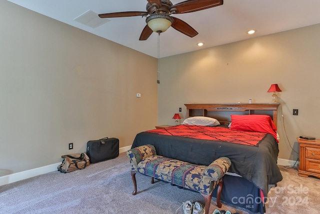 bedroom with ceiling fan and light carpet