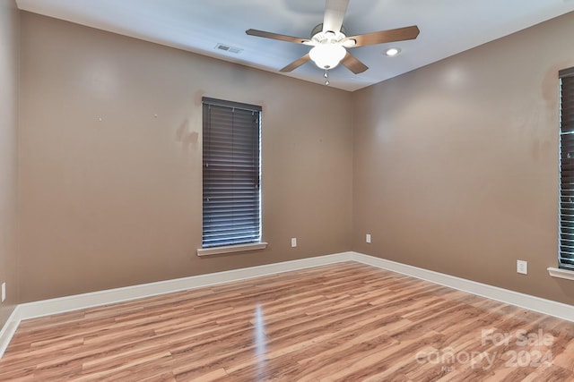 unfurnished room featuring ceiling fan and light hardwood / wood-style flooring