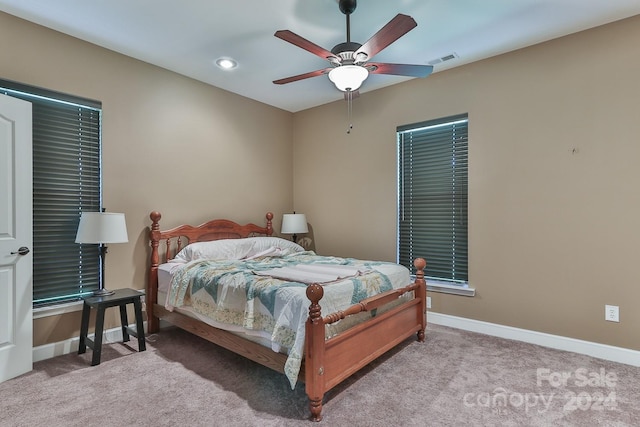 carpeted bedroom with ceiling fan