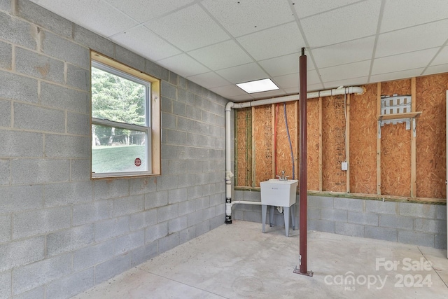 basement featuring a drop ceiling