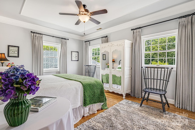 bedroom featuring ceiling fan, light hardwood / wood-style flooring, and access to outside