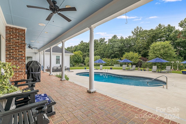 view of pool featuring ceiling fan and a patio