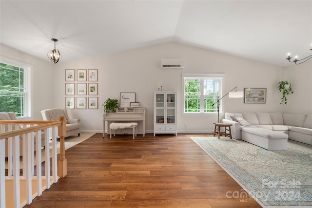 living room with wood-type flooring, vaulted ceiling, and an inviting chandelier