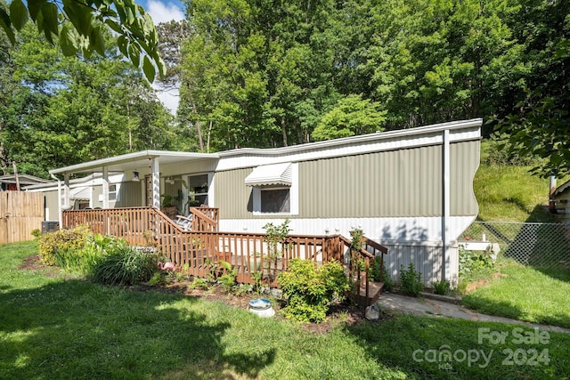 exterior space featuring central AC and a front yard