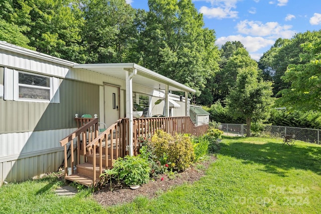 view of yard with a wooden deck