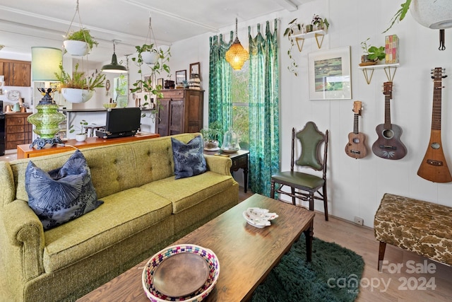 living room with plenty of natural light and hardwood / wood-style floors