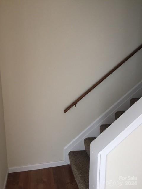 stairs with hardwood / wood-style flooring