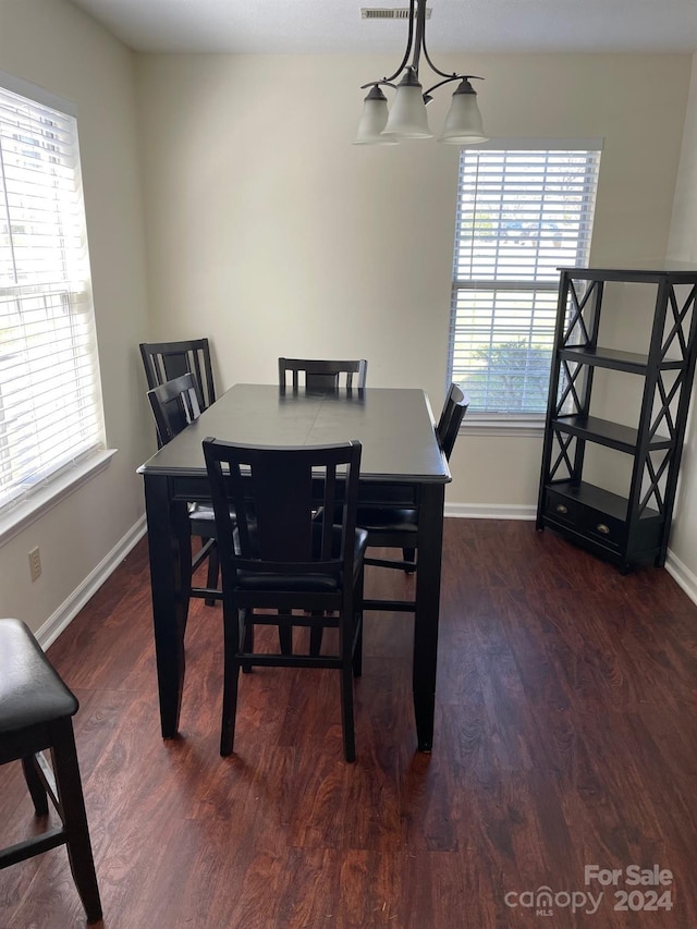 dining area featuring dark hardwood / wood-style flooring