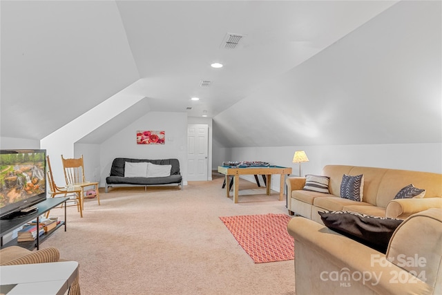 carpeted living room featuring lofted ceiling