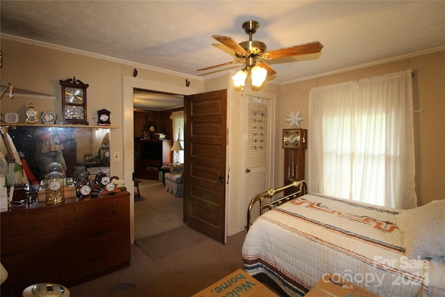 bedroom featuring ornamental molding, a textured ceiling, ceiling fan, and carpet