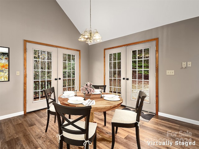 dining room featuring high vaulted ceiling, french doors, and dark hardwood / wood-style flooring