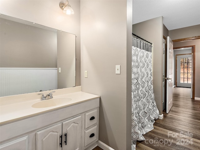 bathroom featuring vanity and hardwood / wood-style floors