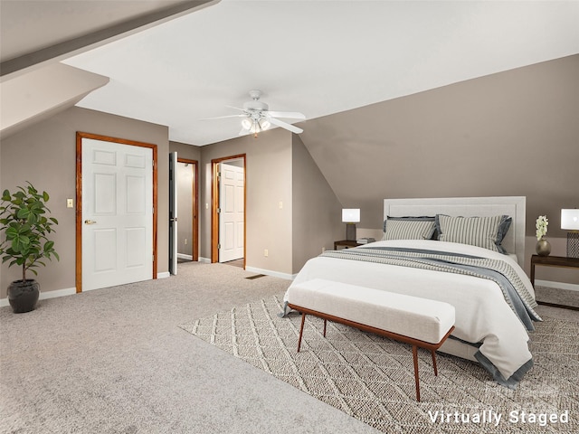 carpeted bedroom featuring ceiling fan and vaulted ceiling