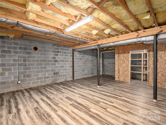 basement with wood-type flooring