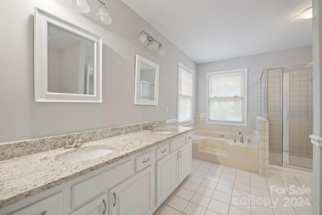 bathroom with independent shower and bath, vanity, and tile patterned floors