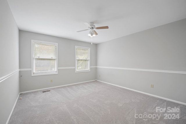 unfurnished room featuring carpet flooring and ceiling fan