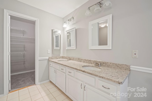 bathroom with vanity and tile patterned floors