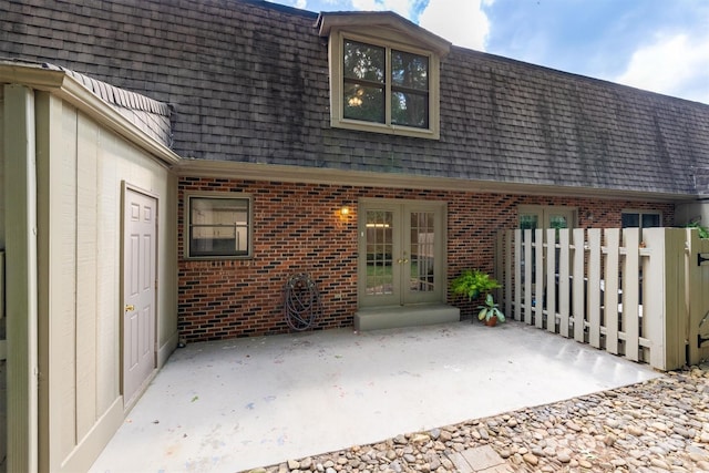 rear view of property featuring a patio and french doors