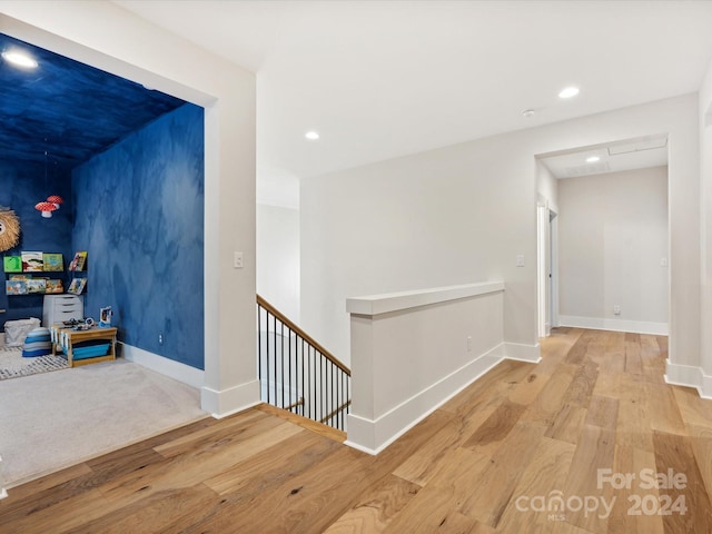 corridor featuring light hardwood / wood-style floors