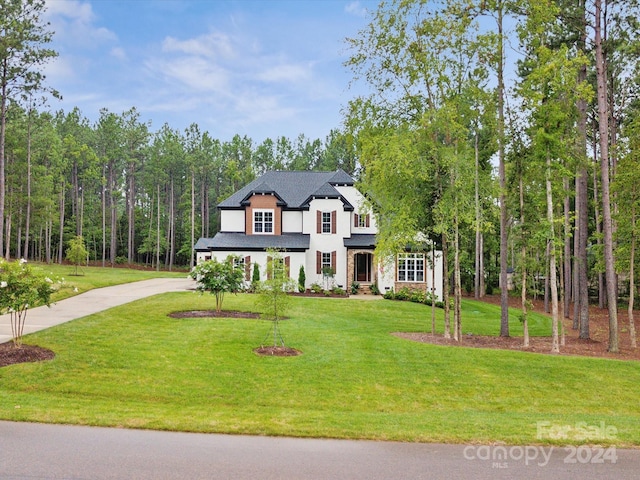 view of front of home with a front yard