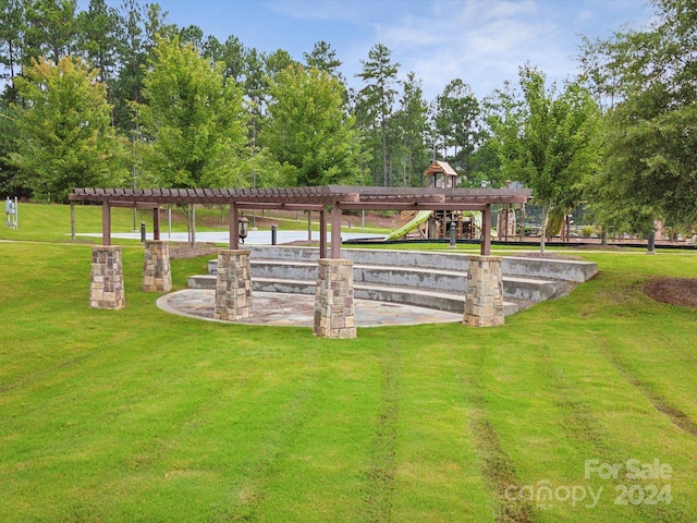 view of home's community featuring a yard and a playground