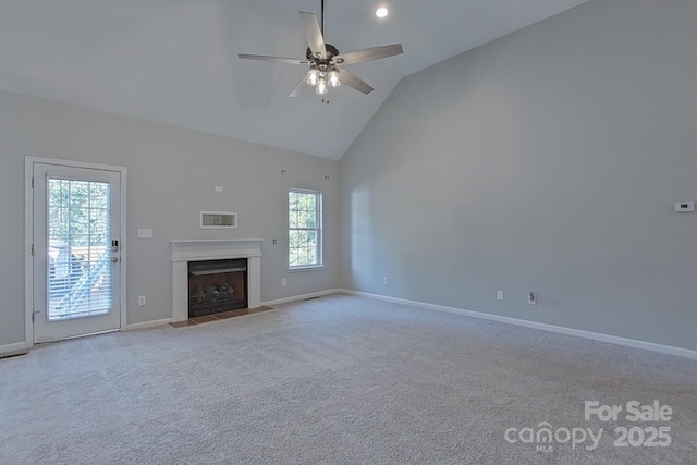 unfurnished living room featuring ceiling fan, lofted ceiling, and light colored carpet