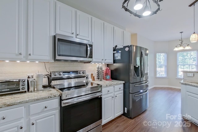 kitchen featuring light hardwood / wood-style floors, white cabinetry, and stainless steel appliances