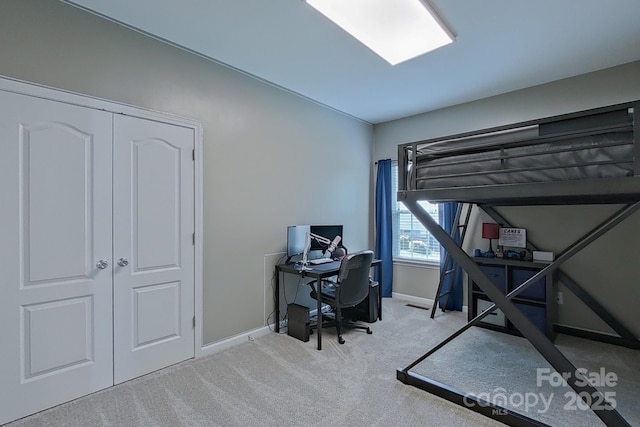 carpeted bedroom with a closet