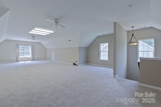 bonus room featuring light carpet, ceiling fan, and lofted ceiling