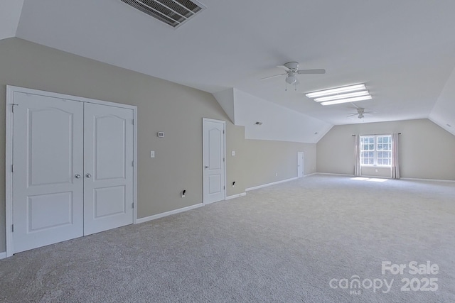 bonus room featuring ceiling fan, lofted ceiling, and carpet floors