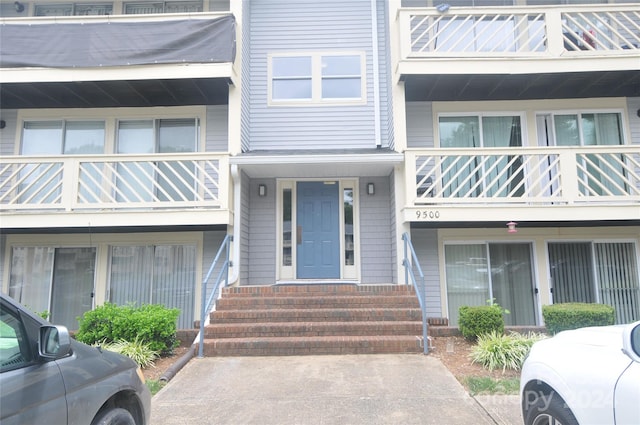 entrance to property featuring a balcony