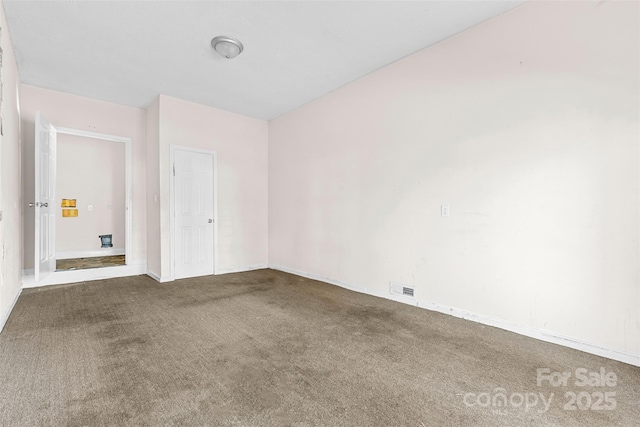 spare room featuring carpet