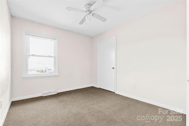 unfurnished room featuring carpet, a textured ceiling, and ceiling fan