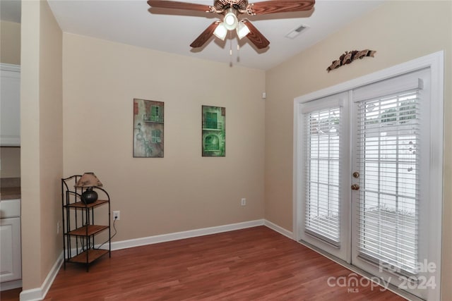 doorway with hardwood / wood-style floors, french doors, and ceiling fan