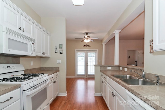 kitchen with light hardwood / wood-style flooring, white cabinetry, sink, white appliances, and ceiling fan