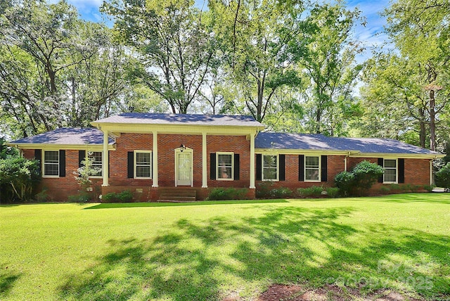 ranch-style home with a front lawn