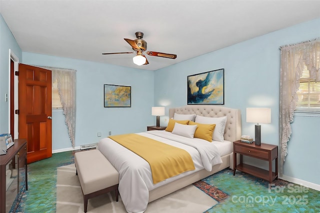 bedroom with ceiling fan and carpet flooring