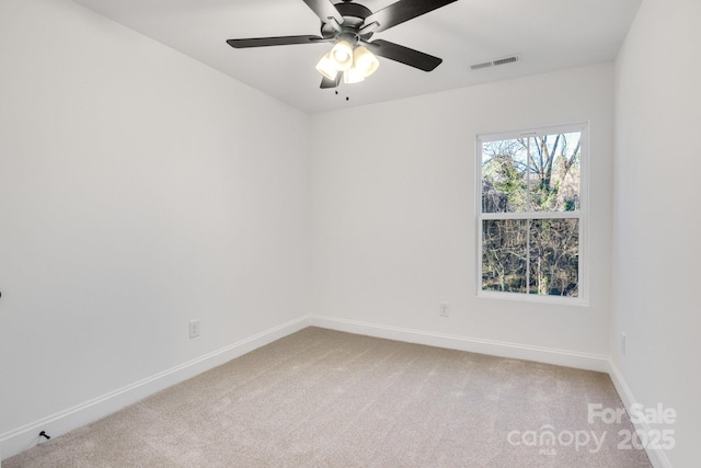 carpeted empty room with ceiling fan