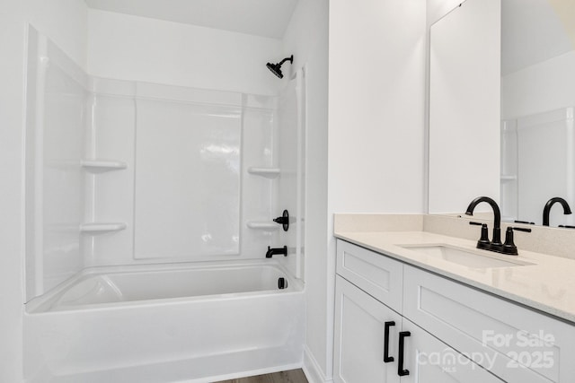 bathroom with vanity and shower / washtub combination