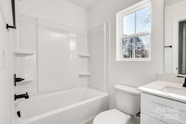 full bathroom with shower / tub combination, vanity, and toilet