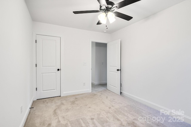 unfurnished bedroom featuring ceiling fan and light colored carpet