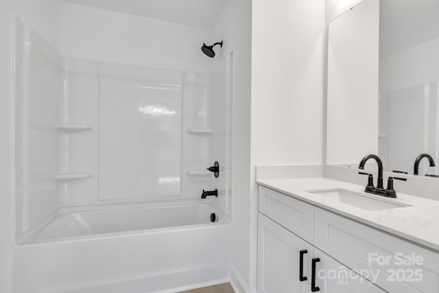 bathroom with vanity and bathtub / shower combination