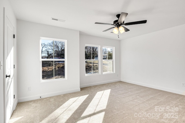 carpeted empty room with ceiling fan