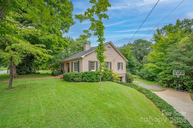 view of property exterior featuring a lawn