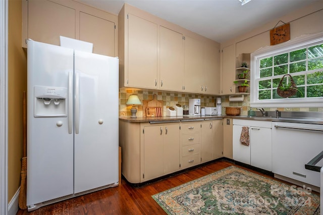 kitchen with sink, white cabinetry, dark hardwood / wood-style floors, white appliances, and backsplash