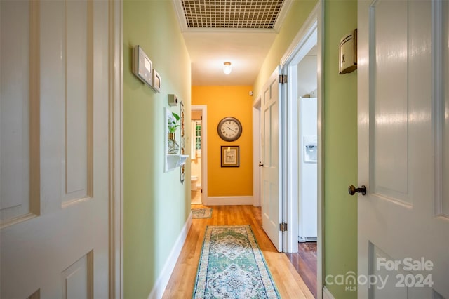 hall with light wood-type flooring