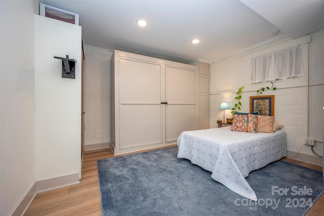 bedroom featuring light hardwood / wood-style floors